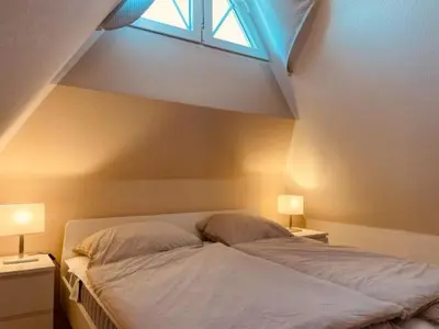 Ein Bett oder Betten in einem Zimmer der Unterkunft Mine-Heimat-Weg 10 Haus Kleines Leuchtfeuer