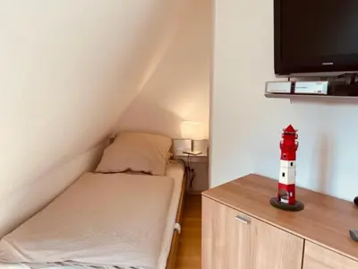Ein Bett oder Betten in einem Zimmer der Unterkunft Mine-Heimat-Weg 10 Haus Kleines Leuchtfeuer