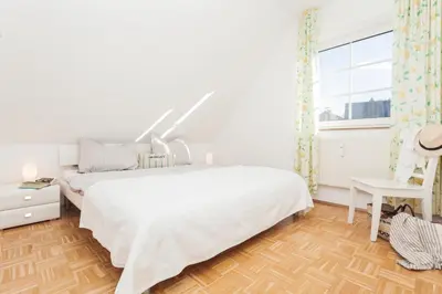 Ein Bett oder Betten in einem Zimmer der Unterkunft Bahnhofstraße 13 Wohnung 3