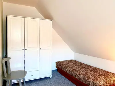 Ein Bett oder Betten in einem Zimmer der Unterkunft Hägerende 66a Haus Ankerplatz Wohnung Oberdeck