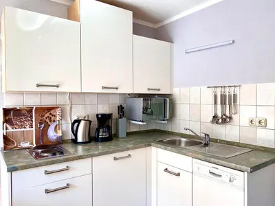 Küche/Küchenzeile in der Unterkunft Hägerende 66a Haus Ankerplatz Wohnung Oberdeck
