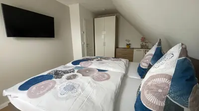 Ein Bett oder Betten in einem Zimmer der Unterkunft Neue Reihe 1 Wohnung 3 