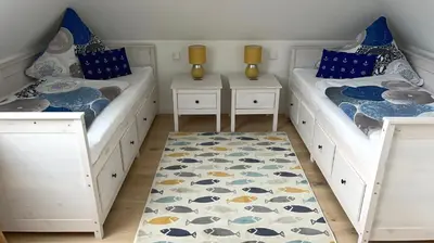Ein Bett oder Betten in einem Zimmer der Unterkunft Neue Reihe 1 Wohnung 3 