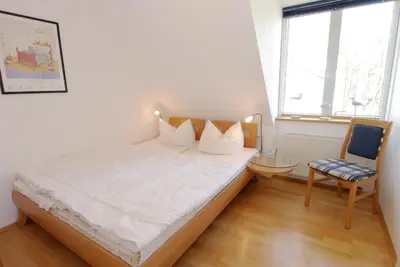 Ein Bett oder Betten in einem Zimmer der Unterkunft Haus Kiek Över 9