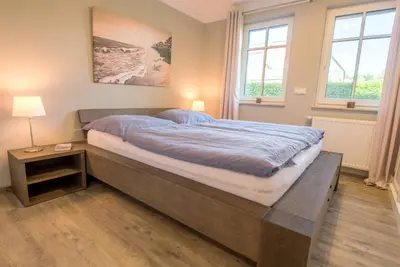 Ein Bett oder Betten in einem Zimmer der Unterkunft Lindenstrasse 13 Wohnung Seenadel