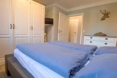 Ein Bett oder Betten in einem Zimmer der Unterkunft Lindenstrasse 13 Wohnung Seenadel