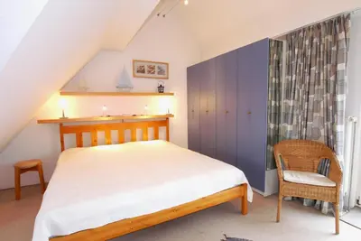 Ein Bett oder Betten in einem Zimmer der Unterkunft Boddenblick Wohnung 27