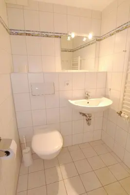 Ein Badezimmer in der Unterkunft Boddenblick Wohnung 27