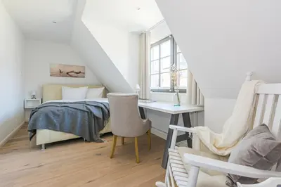 Ein Bett oder Betten in einem Zimmer der Unterkunft Zur Heiderose Haus 8 Villa Pebble
