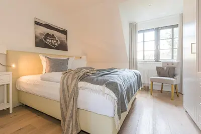 Ein Bett oder Betten in einem Zimmer der Unterkunft Zur Heiderose Haus 8 Villa Pebble