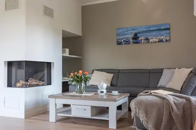 Ein Sitzbereich in der Unterkunft Zur Heiderose Haus 8 Villa Pebble