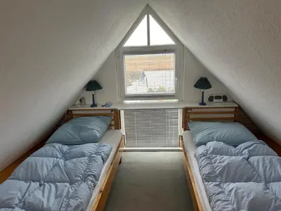 Ein Bett oder Betten in einem Zimmer der Unterkunft Boddenblick Wohnung 28