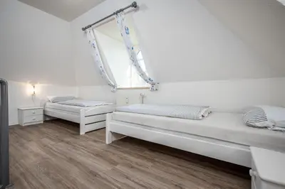 Ein Bett oder Betten in einem Zimmer der Unterkunft Störtebekerstrasse 14 Wohnung 9