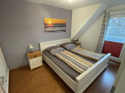 Ein Bett oder Betten in einem Zimmer der Unterkunft Birkenstraße 5g Wohnung Sola Bona