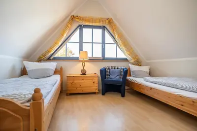 Ein Bett oder Betten in einem Zimmer der Unterkunft Neue Reihe 40 Haus Sonnenhof