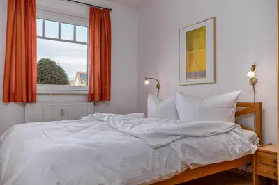 Ein Bett oder Betten in einem Zimmer der Unterkunft Glebbe 17 Wohnung 2