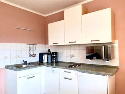 Küche/Küchenzeile in der Unterkunft Hägerende 66a Haus Ankerplatz Wohnung Bootsdeck