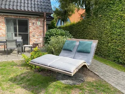 Ein Garten an der Unterkunft Zur Heiderose Haus 5 Sorgenfrei