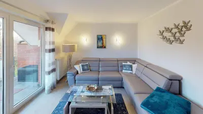 Ein Sitzbereich in der Unterkunft Wohnung Darßer Weg 10a