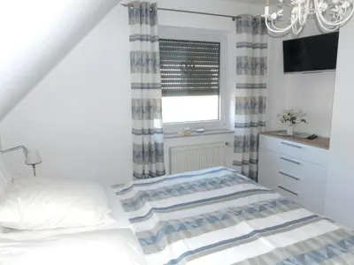 Ein Bett oder Betten in einem Zimmer der Unterkunft Wohnung Darßer Weg 10a