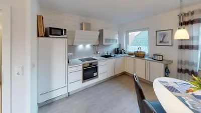 Küche/Küchenzeile in der Unterkunft Wohnung Darßer Weg 10a