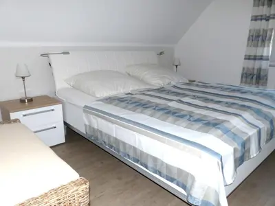 Ein Bett oder Betten in einem Zimmer der Unterkunft Wohnung Darßer Weg 10a
