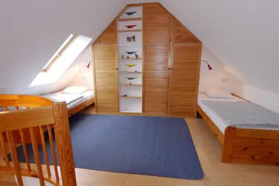 Ein Bett oder Betten in einem Zimmer der Unterkunft Boddenkieker Wohnung 22