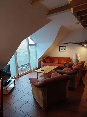 Ein Sitzbereich in der Unterkunft Boddenkieker Wohnung 22