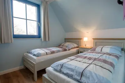 Ein Bett oder Betten in einem Zimmer der Unterkunft Wiesenstraße 65a Haus Casa Blue