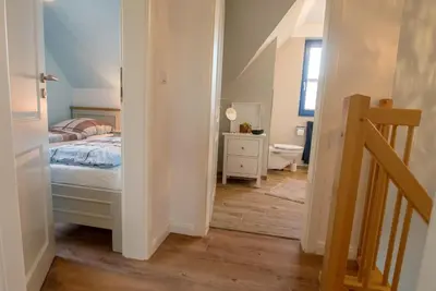 Ein Bett oder Betten in einem Zimmer der Unterkunft Wiesenstraße 65a Haus Casa Blue
