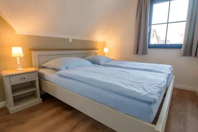 Ein Bett oder Betten in einem Zimmer der Unterkunft Wiesenstraße 65a Haus Casa Blue