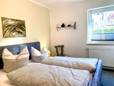 Ein Bett oder Betten in einem Zimmer der Unterkunft Hägerende 66a Haus Ankerplatz Wohnung Brückendeck