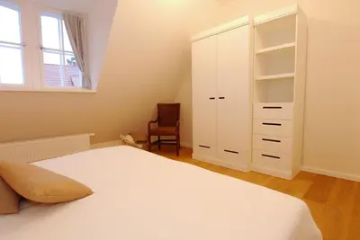 Ein Bett oder Betten in einem Zimmer der Unterkunft Haus Dünenstrasse 19