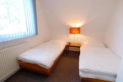 Ein Bett oder Betten in einem Zimmer der Unterkunft Straminke 14a Haus am Strande