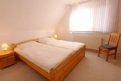 Ein Bett oder Betten in einem Zimmer der Unterkunft Straminke 14a Haus am Strande
