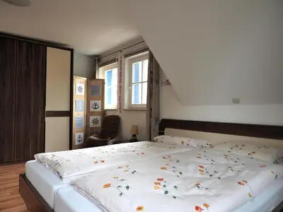 Ein Bett oder Betten in einem Zimmer der Unterkunft Dünengarten Am Bahndamm 75e Haus Meeresrauschen