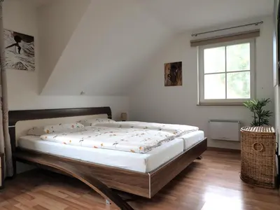 Ein Bett oder Betten in einem Zimmer der Unterkunft Dünengarten Am Bahndamm 75e Haus Meeresrauschen