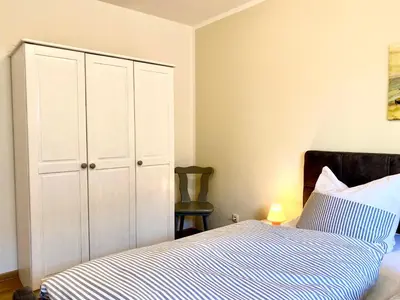 Ein Bett oder Betten in einem Zimmer der Unterkunft Hägerende 66 Haus Windrose Wohnung Nordwind