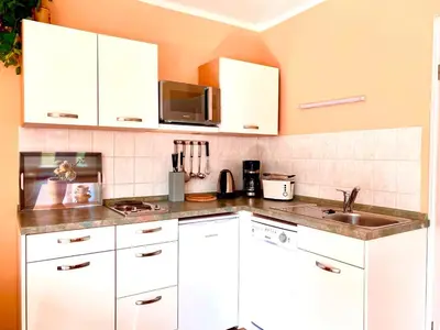 Küche/Küchenzeile in der Unterkunft Hägerende 66 Haus Windrose Wohnung Nordwind