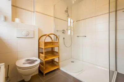 Ein Badezimmer in der Unterkunft Dünengarten Am Bahndamm 77d Haus Seemuschel