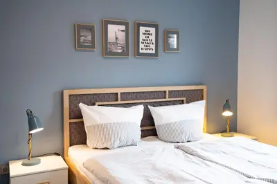 Ein Bett oder Betten in einem Zimmer der Unterkunft Neue Reihe 17 Wohnung Auszeit