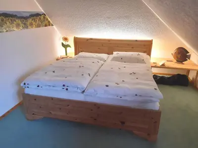Ein Bett oder Betten in einem Zimmer der Unterkunft Schulstrasse Haus Seemöwe