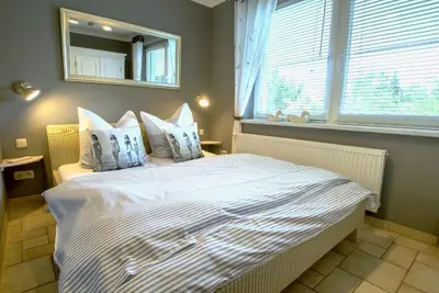 Ein Bett oder Betten in einem Zimmer der Unterkunft Hafenstraße 26 Wohnung Lütt'n Tohuus