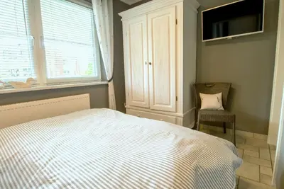 Ein Bett oder Betten in einem Zimmer der Unterkunft Hafenstraße 26 Wohnung Lütt'n Tohuus