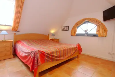 Ein Bett oder Betten in einem Zimmer der Unterkunft Birkmaase 9 Wohnung Villa Meereslust