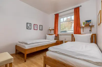 Ein Bett oder Betten in einem Zimmer der Unterkunft Glebbe 17 Wohnung 1