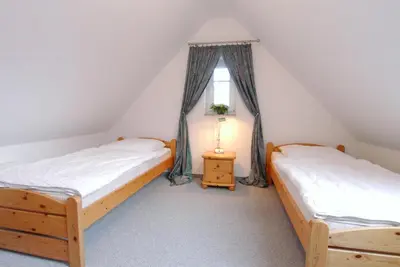 Ein Bett oder Betten in einem Zimmer der Unterkunft Hoppenberg 7 Wohnung DG links