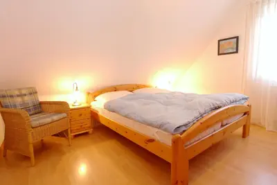 Ein Bett oder Betten in einem Zimmer der Unterkunft Hoppenberg 7 Wohnung DG links