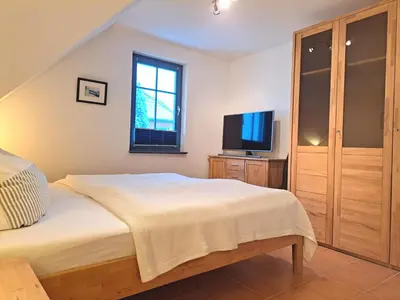 Ein Bett oder Betten in einem Zimmer der Unterkunft Birkmaase 10 Wohnung Ostseestern