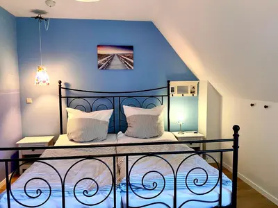 Ein Bett oder Betten in einem Zimmer der Unterkunft Heideweg 10a Haus Thea Luise